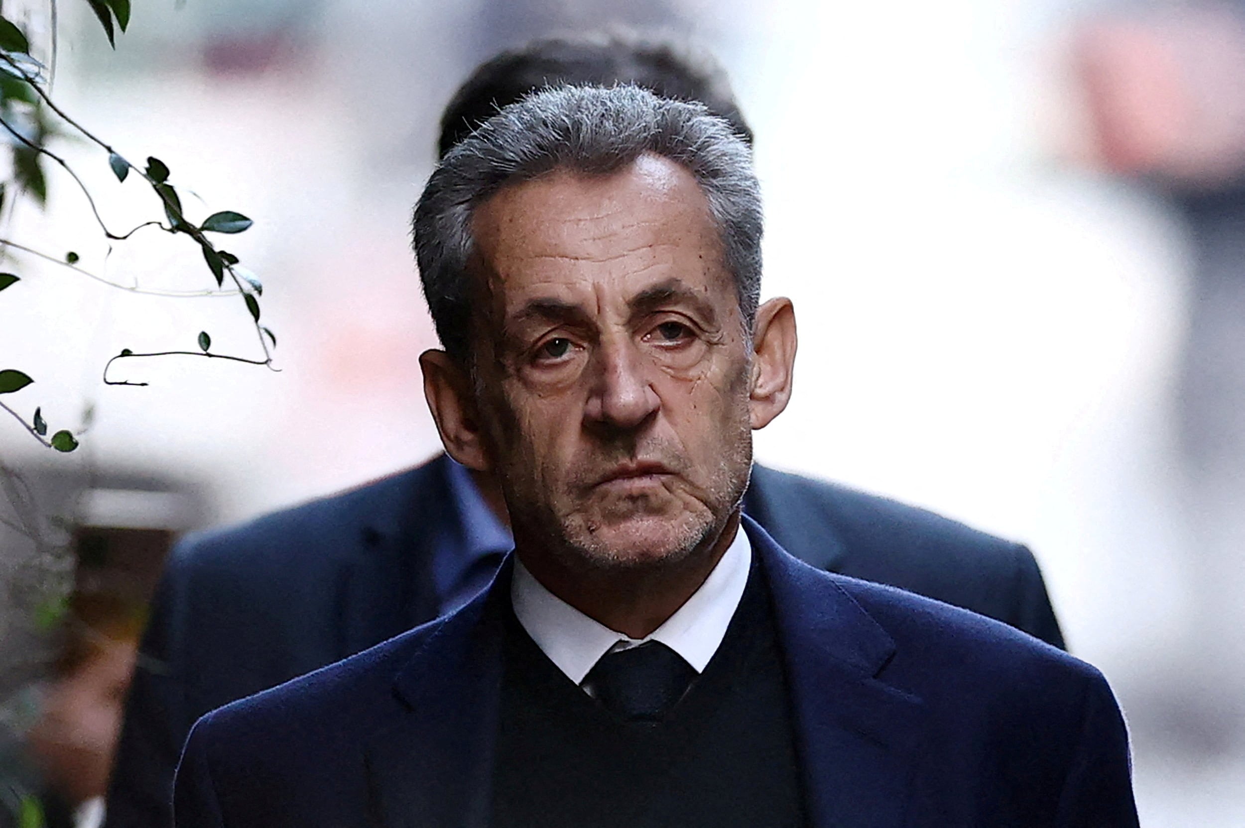 FILE PHOTO: FILE PHOTO: Former French president Nicolas Sarkozy leaves his house on the day of his incarceration at the Sante prison to begin his five-year prison sentence for criminal conspiracy over attempts to raise campaign funds from Libya, in Paris, France, October 21, 2025. REUTERS/Sarah Meyssonnier/File Photo/File Photo