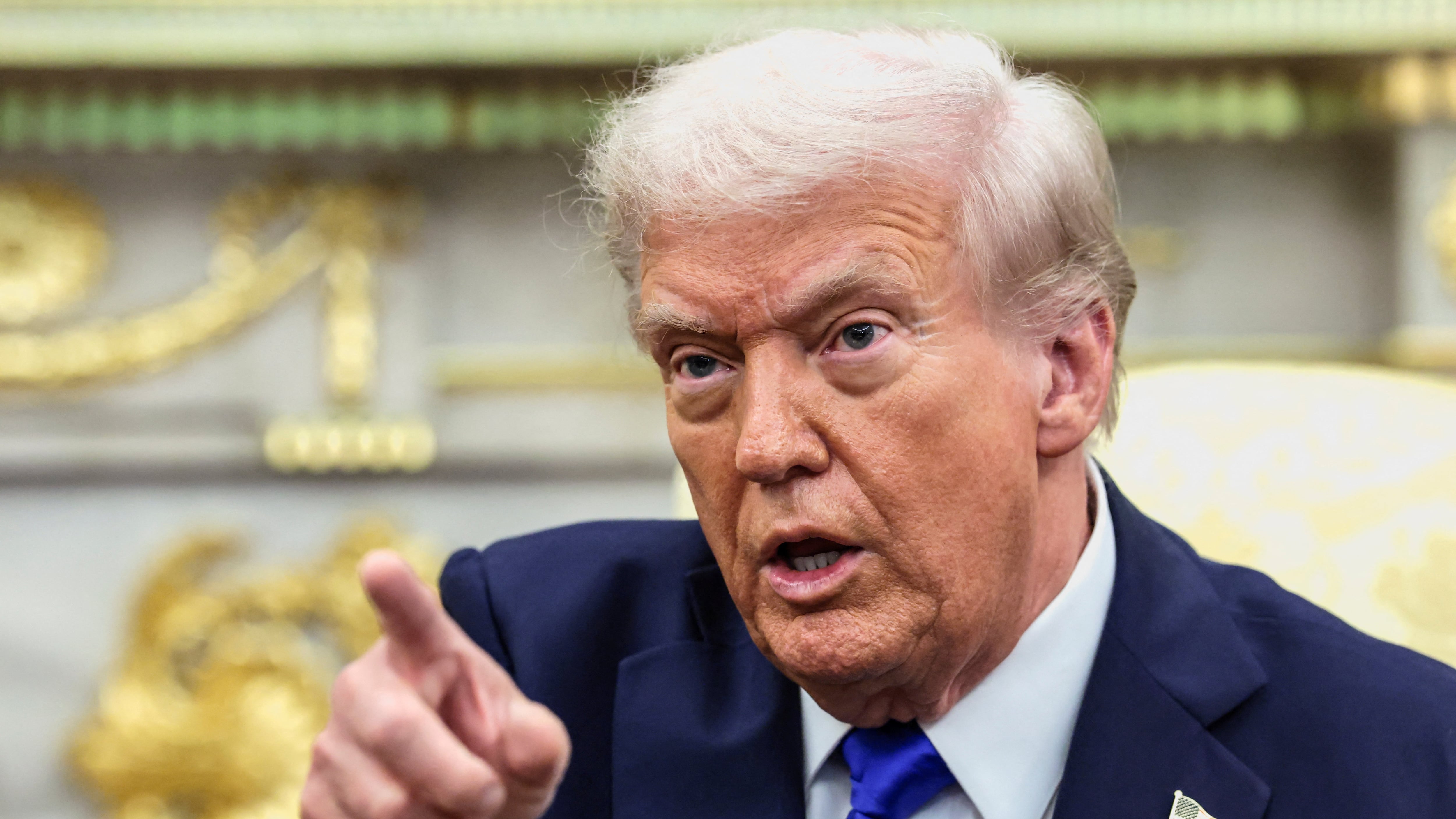 U.S. President Donald Trump points a finger during a meeting with Canada's Prime Minister Mark Carney (not pictured) in the Oval Office at the White House in Washington, D.C., U.S., October 7, 2025. REUTERS/Evelyn Hockstein