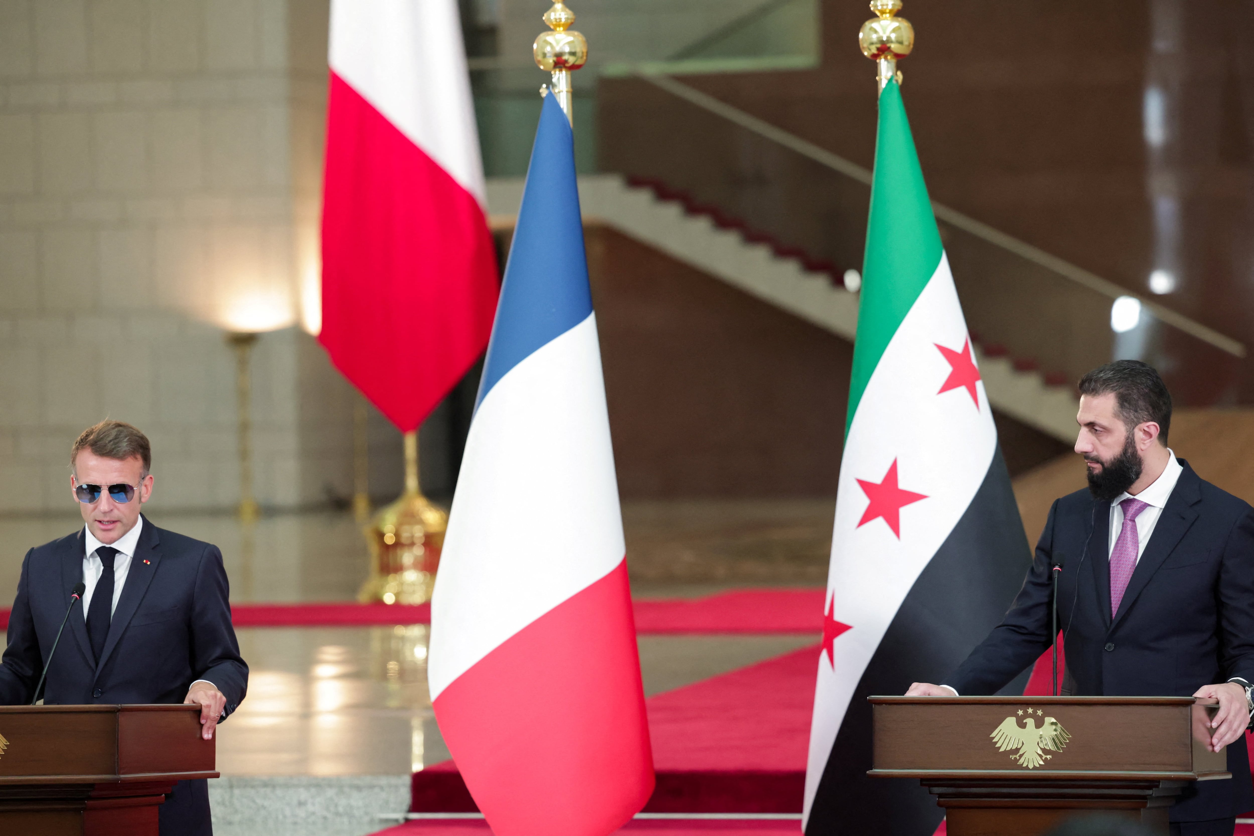 France's President Emmanuel Macron and Syrian President Ahmed Al-Sharaa attend a press conference in Damascus, Syria, July 7, 2026. REUTERS/Mahmoud Hassano